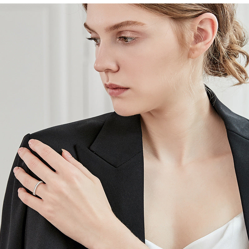 Elegant Women's Sterling Silver Ring with Sparkling Moissanite Inlaid,Unique Design for Fashion Jewelry Lovers.